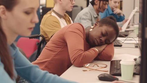 African American Female Uni Student Napping during Class