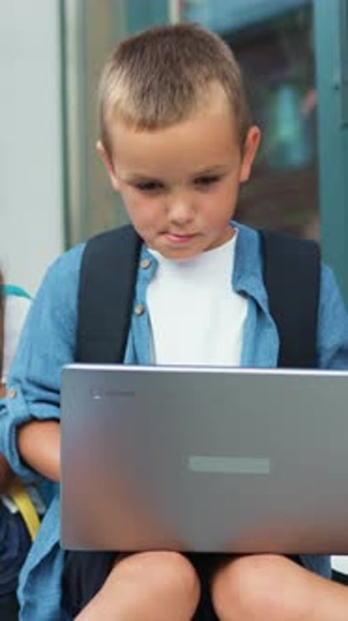 School Small Students Friends Outdoors Using Laptop Computer Kids Sitting on Stairs and Play on