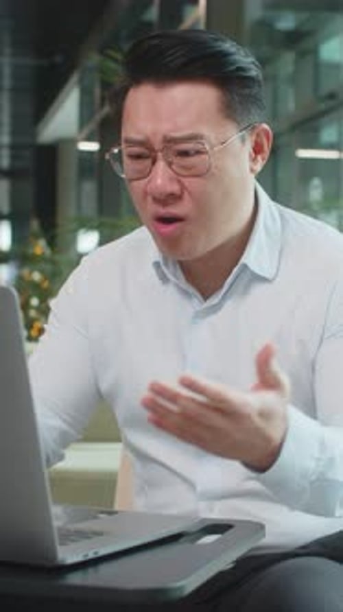 Sad Businessman Using Laptop Loses Becoming Shocked Sudden Lottery Results in Modern Hotel Lobby