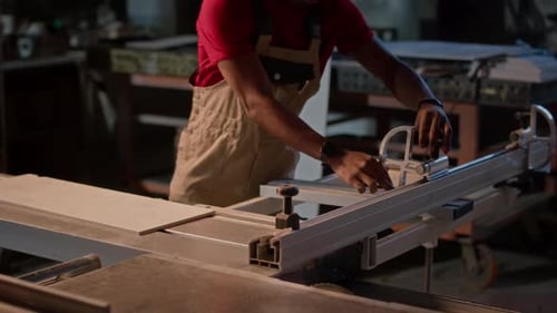 Workman Working On Machine In Factroy
