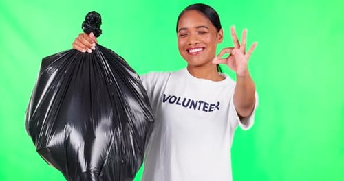 Cleaning, OK and volunteer or woman on green screen of trash, pollution and climate change support