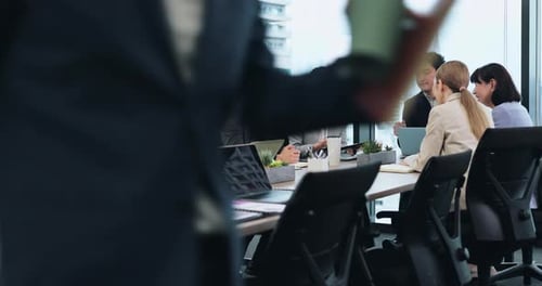 Office Meeting with Adults Talking at Conference Table