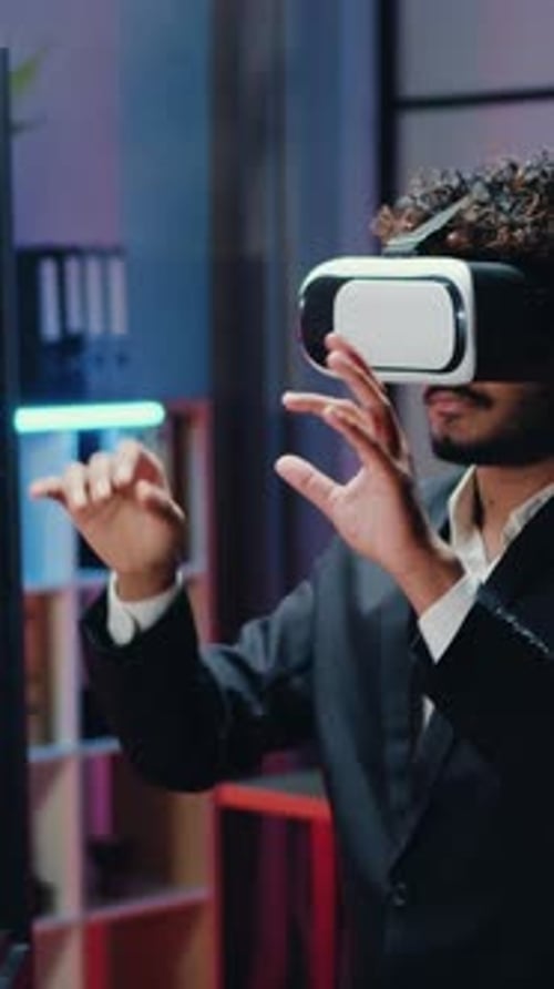 Goodlooking Man Office Worker Moving Hands on Virtual Display in Special 3d Glasses While Working