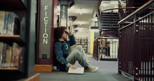 Stress, frustrated student and man in library for test fail, depression