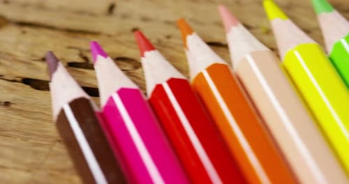 Colorful Pencils on Wood Surface Dolly Shot