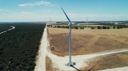 Aerial View of Rural Wind Turbines on Sunny Day