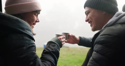 Cheers, camping and couple drinking coffee on a forest date, adventure and happy to travel together