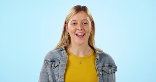 Happy, woman and emoji to whisper secret, gossip or confidential information on blue background