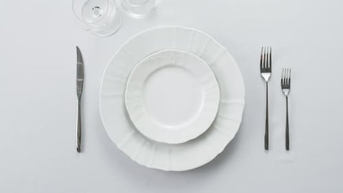 Elegant Table Setting with White Plates Overhead Shot