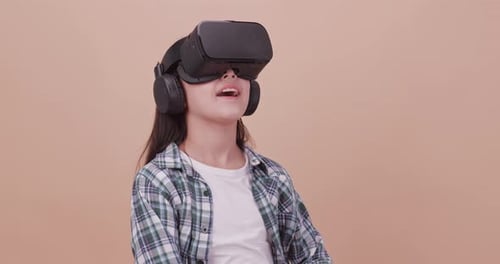 Girl Exploring Virtual World With VR Headset