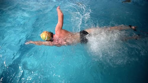 Underwater View of Professional Swimmer Training in Swimming Pool 120 Fps Super Slow Motion Raw