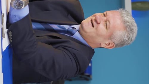 Business Man Happily Signing Documents in Office