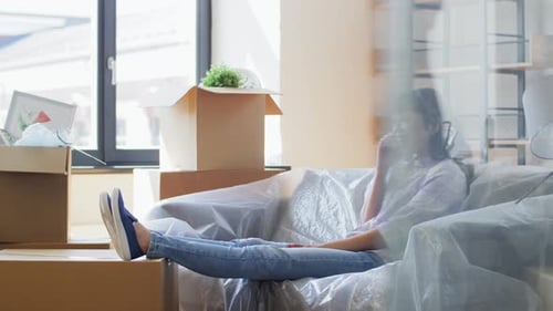 Moving, People and Real Estate Concept - Happy Smiling Asian Woman With