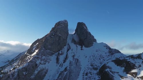 Aerial view of Les Jumelles snowy peaks, Switzerland.