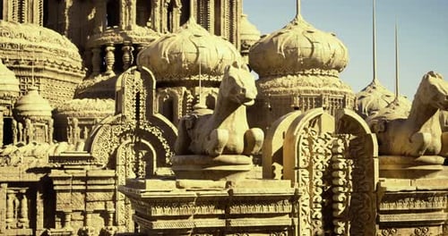 Intricate Stone Carvings of a Historic Temple Featuring Equine Statues