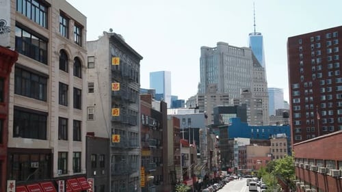 Streetview of busy Manhattan neighborhood towards financial district in New York City