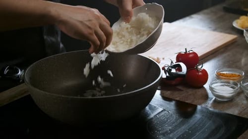 Adding Chopped Onions to Skillet for Cooking