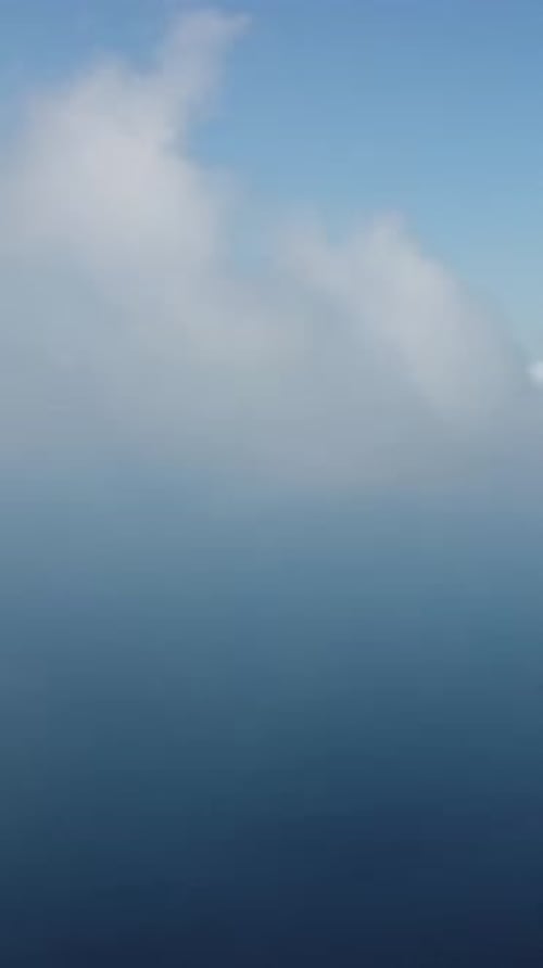 Aerial Vertical View Over Foggy and Fluffy Clouds Blue Sky Sun and Sea Fog Abstract Aerial Nature