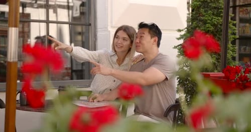Young Couple Having Brunch at Traditional Cafe in Europe