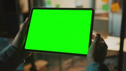 Horizontal Shot of Digital Tablet in Man's Hands Unrecognizable Man Touching Green Screen Swiping