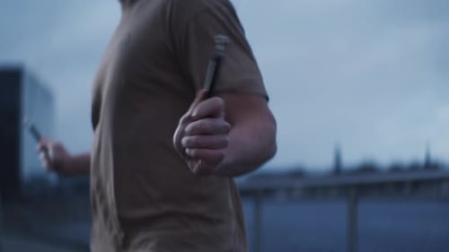 Athletic Adult Jumping Rope in City Setting