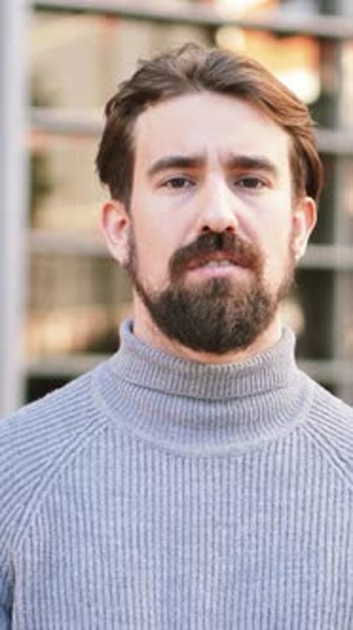Vertical Close Up Portrait of Young Caucasian Man Isolated Outdoors Photoshot of Real Emotions of