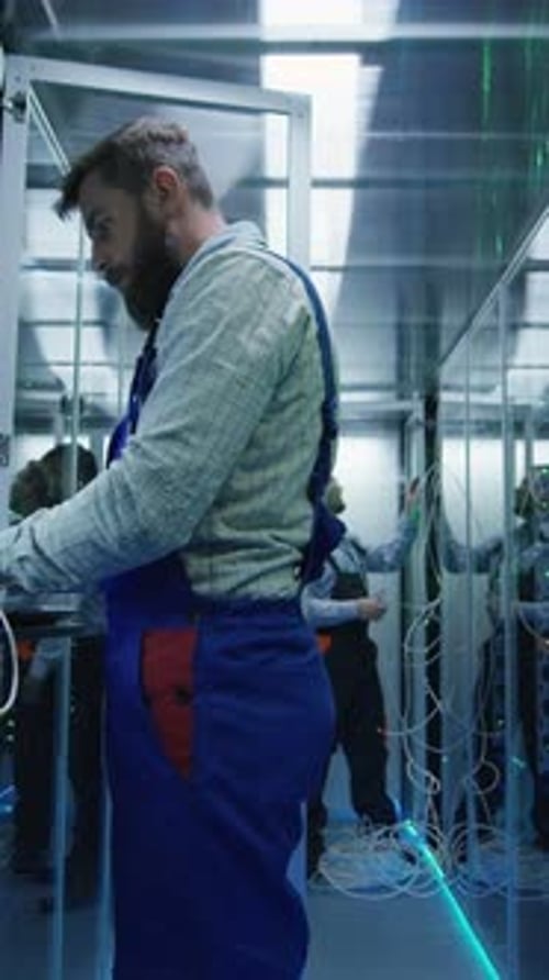 Two Technicians Working in a Data Center