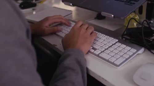 Close Up Male Hacker Typing at Laptop During Hackathon 2024 Years
