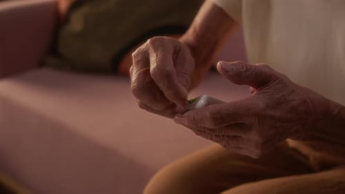 Senior Hands Test Blood Sugar in Home Setting