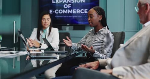 Business Professionals Meeting in Corporate Boardroom