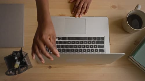 Hands of Black Woman Opening Laptop and Typing on Keyboard