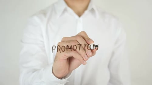 Hand Writes Promotion With Marker Close Up