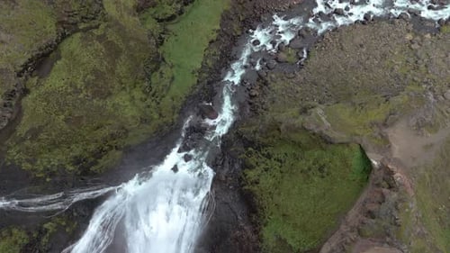 Icelandic Waterfall And Volcanic Glacier Captured By Aerial Drone