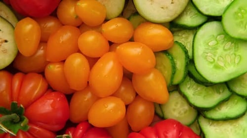 Colorful Vegetables: Fresh Tomatoes, Cucumbers, and Eggplant Close-up