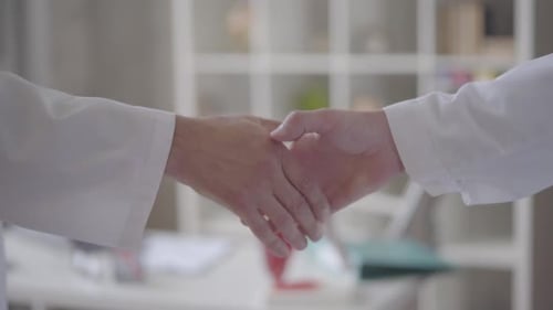 Doctors Shaking Hands Successful Agreement on Collaborative Medical Partnership and Treatment
