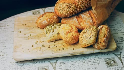 Assortment of Freshly Baked Bread on Cutting Board
