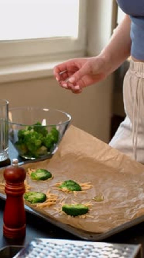 Woman Preparing Healthy Brussels Sprouts on Baking Sheet