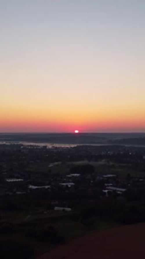 Orange Sunrise over Quiet Rural Town