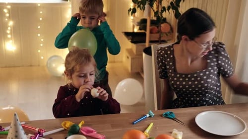 Children Blow up Balloons for Birthday Party