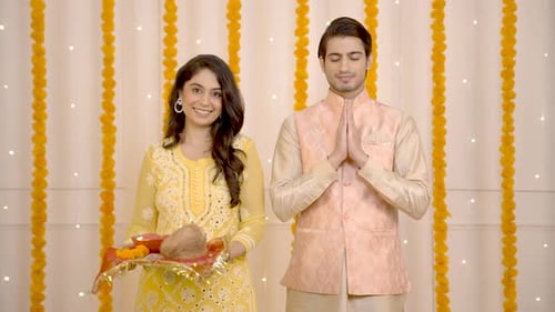 Woman and Man Posing for Diwali Celebration at Home