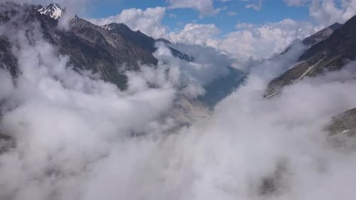 Beautiful Mountain Scenery with Swirling Clouds in an Aerial View of a Gorge