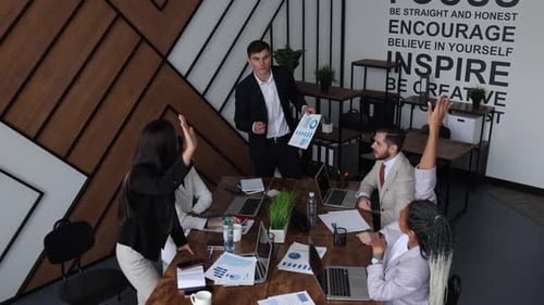 Meeting of Employees in the Office at a Large Table
