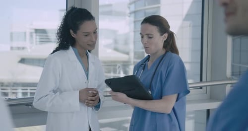 Medical Staff Discussing Patient Care in Modern Hospital