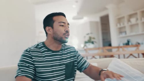 Young Couple Arguing on a Couch at Home