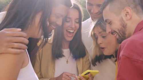 Happy Friends Watching Smartphone Together Outdoors