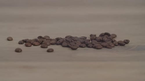 Close up of seeds of coffee. Fragrant coffee beans are roasted smoke comes from coffee beans.
