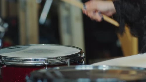 Close-Up of Hands of Girl Playing on Drums