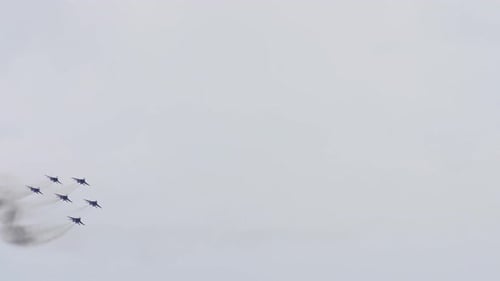 Airplanes Flying in Formation with Smoke Trails