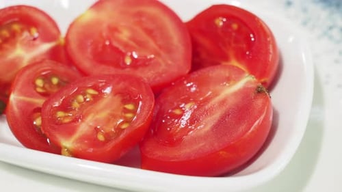 Close Up of Cherry Tomato Slices on Table
