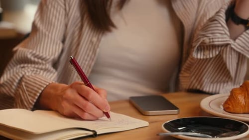 Caucasian Woman Sitting in Cafe Female Girl Writing Notes in Notebook Write Idea Plan Noting